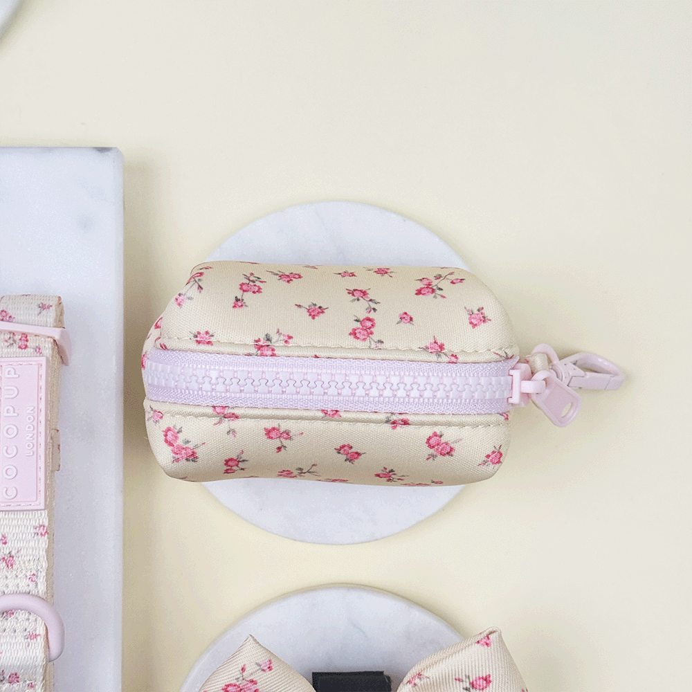 Floral Dog Poop Bag Holder with yellow background and pink flowers.