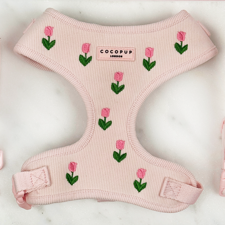 Pink dog harness with tulip embroidery design, with Cocopup logo.